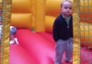 Youll never be cooler than this two-year-old on a bouncy castle