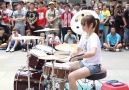 Young woman loves to play the drums.