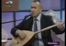 Muharrem Temiz - Gapının Önünde Önlük Dikiyi